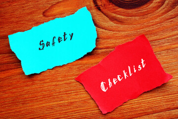Financial concept about Safety Checklist with inscription on the sheet.