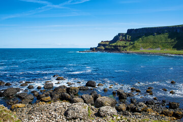 Landscape of Giant's Causeway trail with a blue sky in summer in Northern Ireland, County Antrim....