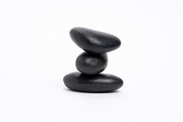 Zen concept: stones arranged against white background