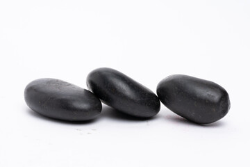 Zen concept: stones arranged against white background