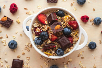 Muesli from oatmeal, berries view from above. Easy morning breakfast with granola