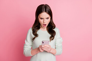 Portrait of impressed lady open mouth staring screen disbelief unfollow isolated on pink color background
