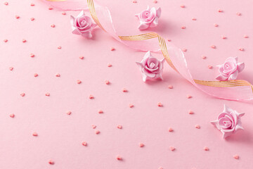 Pink background with candy hearts sweet flowers and ribbon for Valentine day, wedding, dating or mothers day
