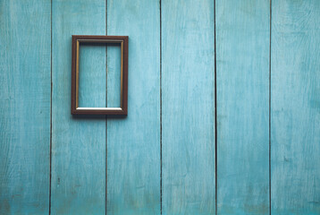 wooden photo frame on wooden wall
