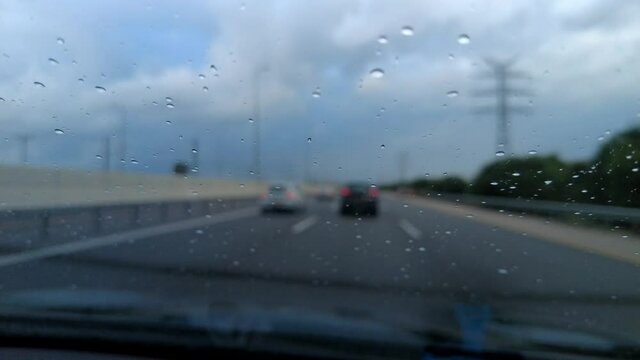 Timelapse of driving highway in the rain