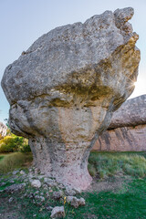 Huge boulder and starry sun in the edge