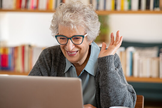 Senior woman using laptop to make a video call