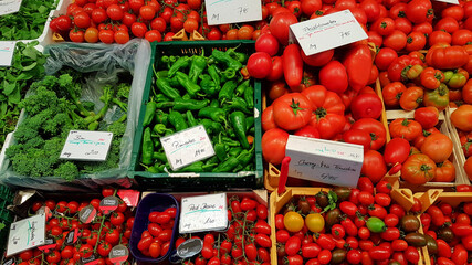 Colorful green and red vegetables and groceries at a market 