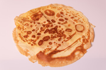 yellow pancake with spots on the back side diagonal view