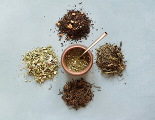  different types of dry tea, in the middle of a calabas with mate . Tea party concept
