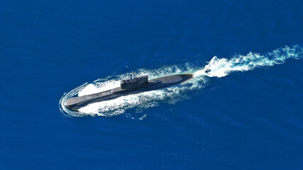Aerial drone photo of latest technology navy armed diesel powered submarine cruising half submerged