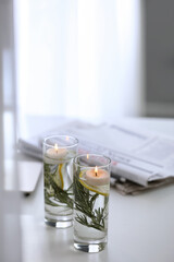 Natural homemade mosquito repellent candles on white table indoors