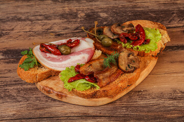 Italian appetizer - bruschetta mix with meat