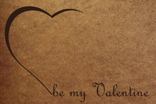 valentine card with a brown shadow from a cardboard heart and a brown inscription "be my valentine" on cardboard