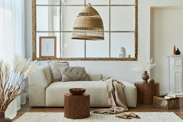 Stylish interior of living room with design modular sofa, furniture, wooden coffee table, rattan...