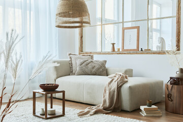 Stylish interior of living room with design modular sofa, furniture, wooden coffee table, rattan...