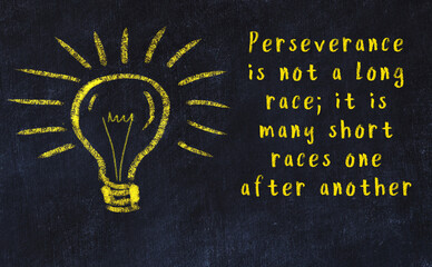 Chalk drawing of a bulb and inscription of wise quote