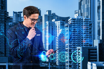 A young handsome eastern cybersecurity developer explores new approaches to protect clients confidential information using phone. IT lock icons over Bangkok city background.