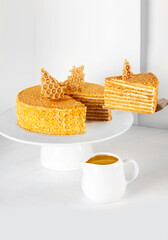 Golden honey seven layered cake with honey comb biscuit