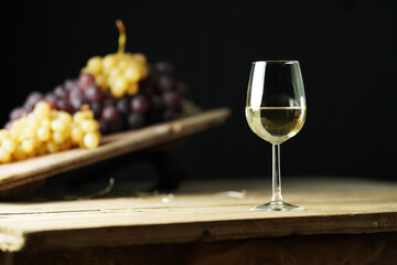 A glass of white wine on the rustic table