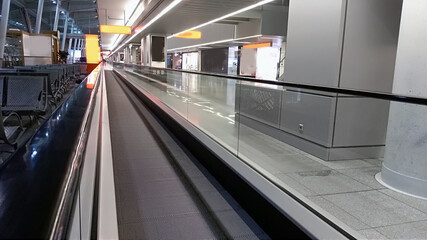 horizontal escalator at the airport/ details of a slidewalk, or moveator at an airport.