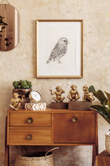 Retro composition of living room interior with wooden vintage commode, gold pink mirror, mock up...