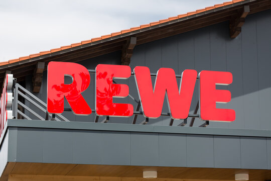 Riederau, Bavaria / Germany - Jul 20, 2019: Close Up Of Rewe Sign. The Supermarket Chain Is Part Of Rewe Group.