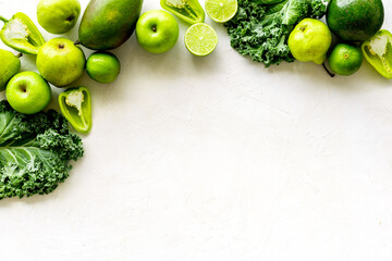 Background of raw green vegetables and herbs, top view