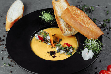 Autumn pumpkin cream soup with dor blue