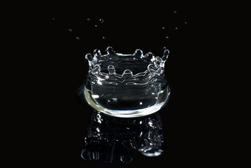 water splash isolated on black. fresh clean transparent drinking water splash.