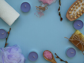 Background of spa products for home treatments with space for text. Bath sea salt, massage brush,...