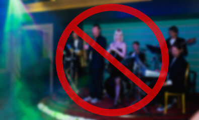 Red sign warning of music concert canceled due to coronavirus
