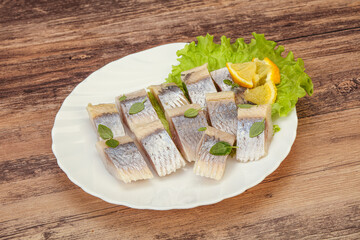 Herring fillet with sliced lemon