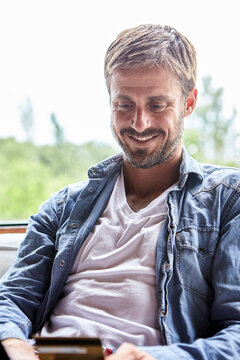 Smiling mid adult man making online payment