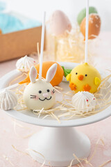 Delicious sweet cake pops on light background, closeup. Easter holiday.