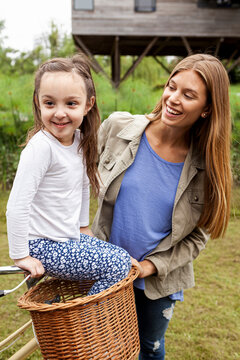 Smiling mother looking at her daughter