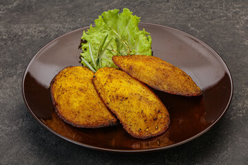 Baked potato with herbs and spices