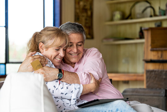Senior couple using digital tablet - Powered by Adobe