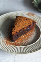 Chocolate cake with cherry on a plate