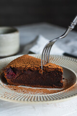 Chocolate cake with cherry on a plate
