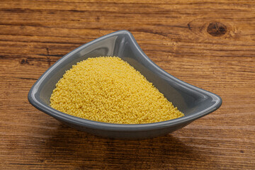 Raw cous cous heap in the bowl