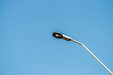 A street lamp in the middle in the sky background
