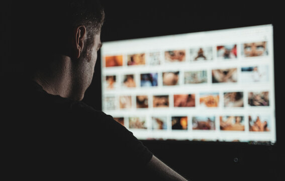 Man browsing porn site late at night.