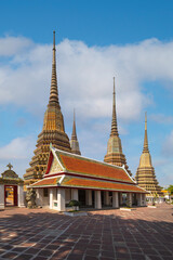 Beautiful stupas decorated with colorful mosaic big pagoda and Thai art architecture of Wat Pho temple in Bangkok, Thailand.