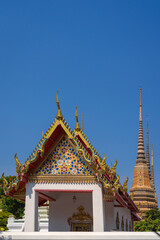 Beautiful stupas decorated with colorful mosaic big pagoda and Thai art architecture of Wat Pho temple in Bangkok, Thailand.