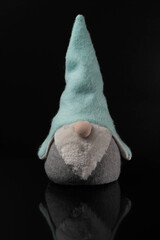 gnome in a blue hat with a big nose