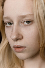 Closeup portrait of  young woman with blonde hair