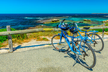 Tourist bicycles parked at Parker Point, a lookout overlooking tropical and pristine white beaches of Western Australia's Rottnest Island, a popular summer holiday destination near Perth.