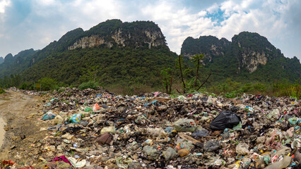 Illigal garbage dump at edge of national park in vietnam