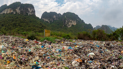 Illigal garbage dump at edge of national park in Vietnam